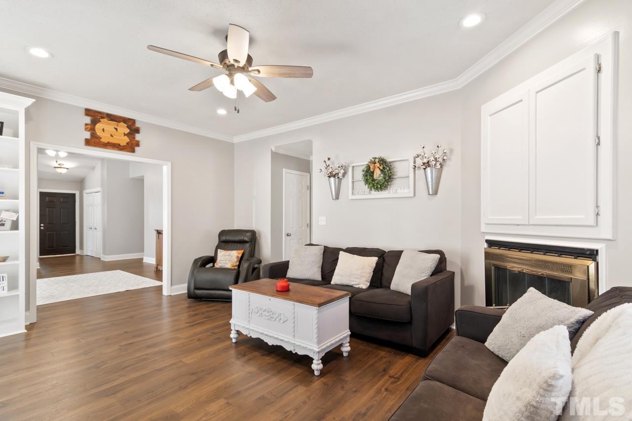 6908 Kiger Road Rougemont, NC 27572 - Photo 15 of 30 a living room with furniture and a fireplace