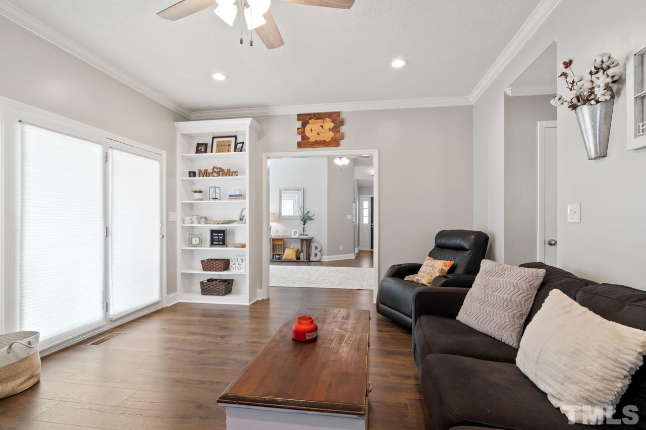 6908 Kiger Road Rougemont, NC 27572 - Photo 16 of 30 a living room with furniture and wooden floor