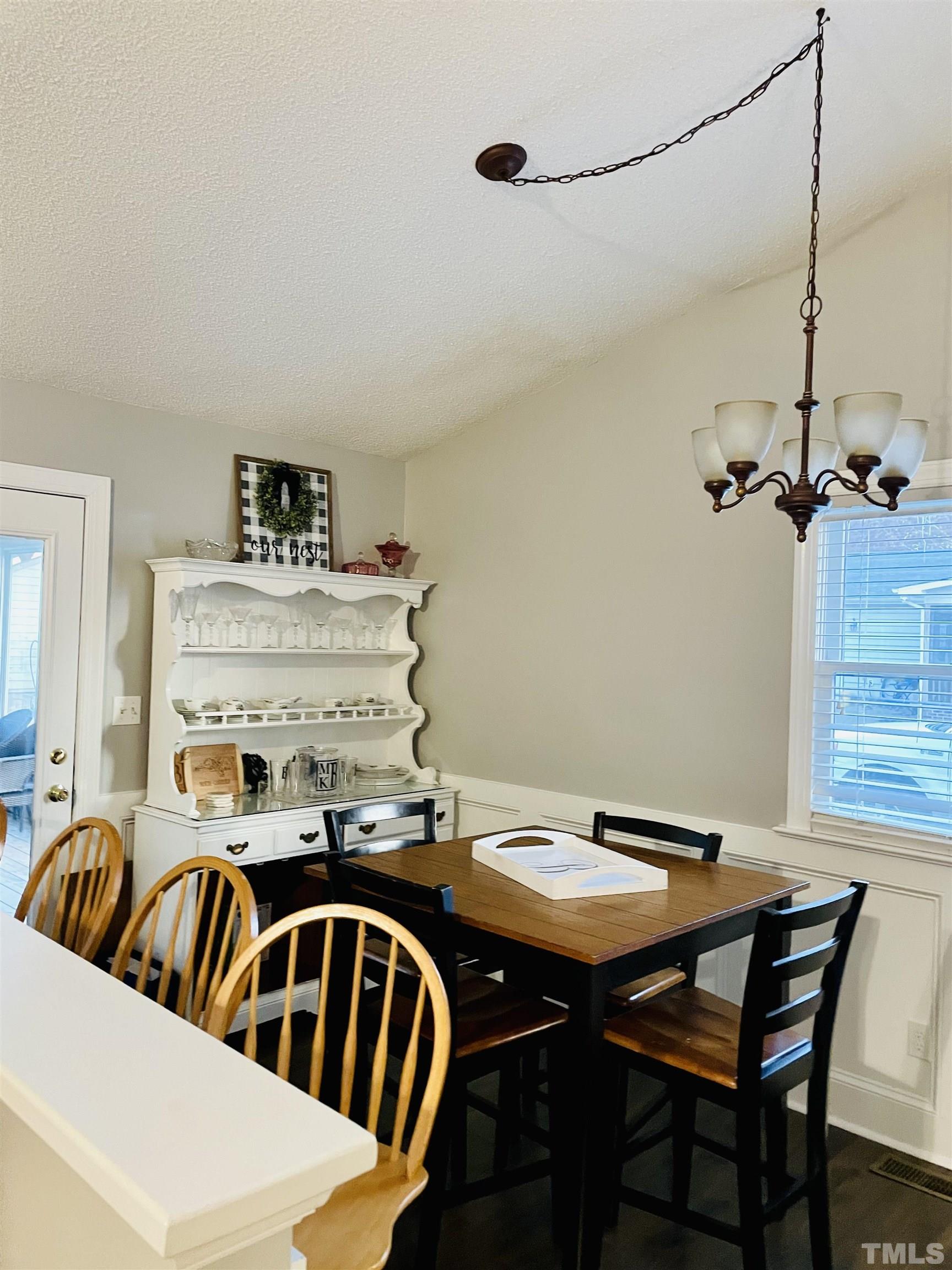 6908 Kiger Road Rougemont, NC 27572 - Photo 3 of 30 a view of a dining room with furniture