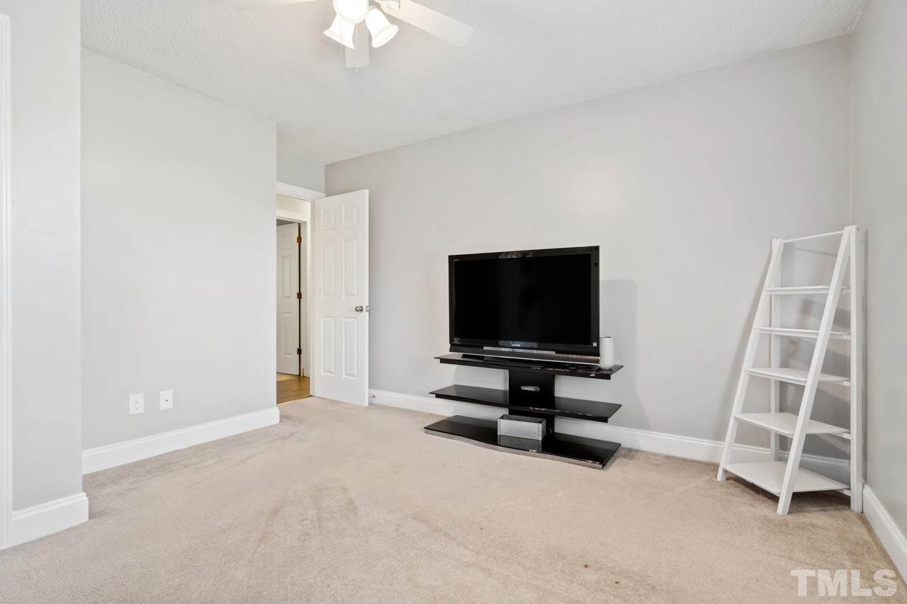 6908 Kiger Road Rougemont, NC 27572 - Photo 25 of 30 a view of room with hardwood floor and cabinet