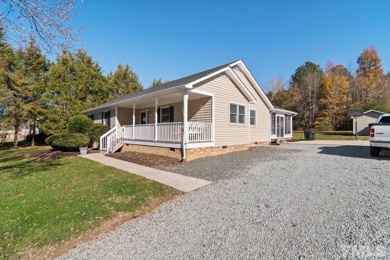 6908 Kiger Road Rougemont, NC 27572 - Photo 27 of 30 a view of a house with a yard and large tree
