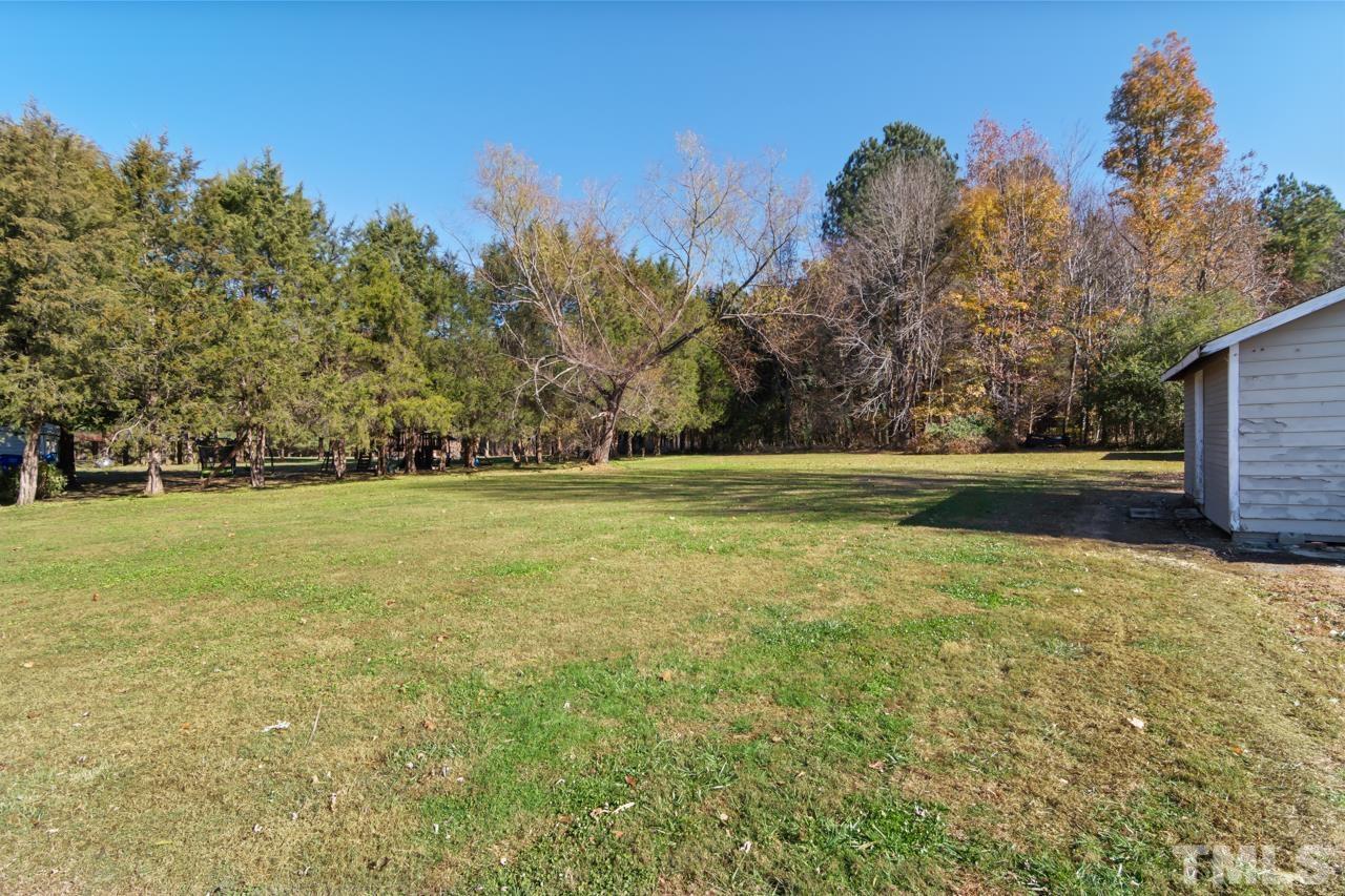 6908 Kiger Road Rougemont, NC 27572 - Photo 28 of 30 a view of outdoor space with deck and yard