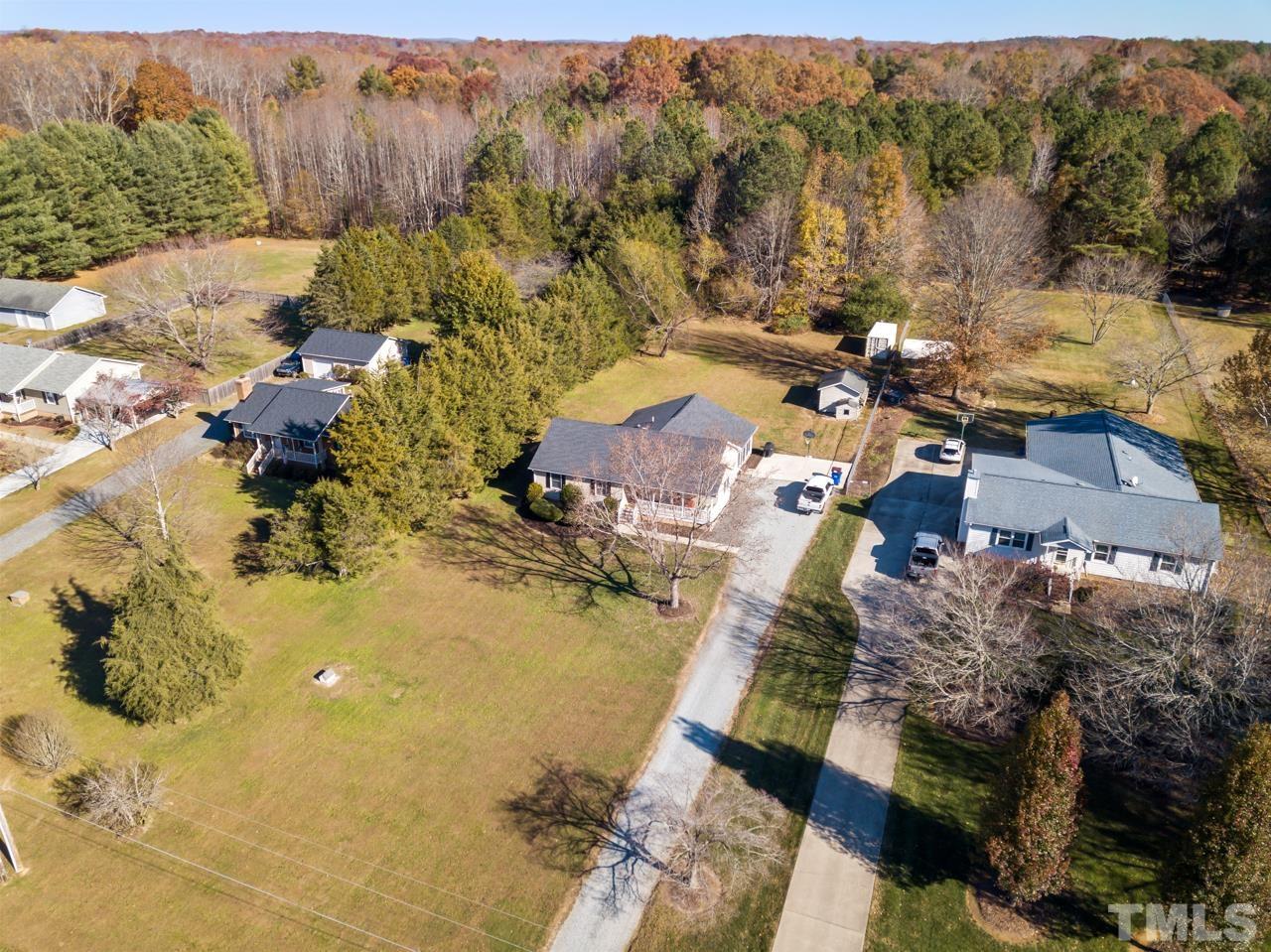 6908 Kiger Road Rougemont, NC 27572 - Photo 29 of 30 an aerial view of residential houses with outdoor space