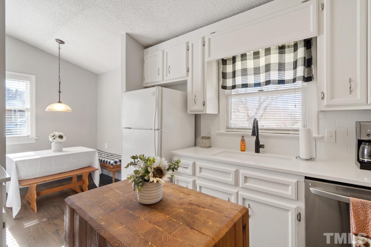 6908 Kiger Road Rougemont, NC 27572 - Photo 5 of 30 a kitchen with a sink and cabinets