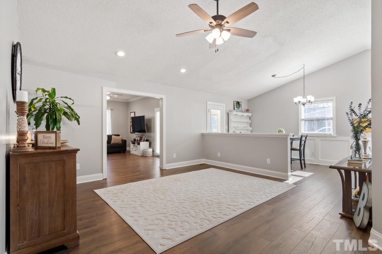 6908 Kiger Road Rougemont, NC 27572 - Photo 7 of 30 a living room with furniture and a wooden floor