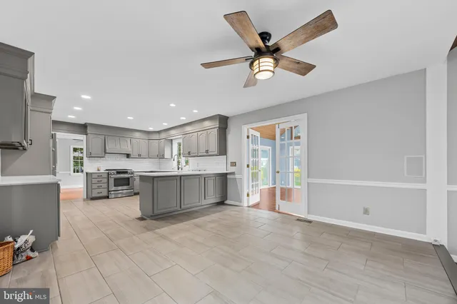 a view of a room with window and a ceiling fan