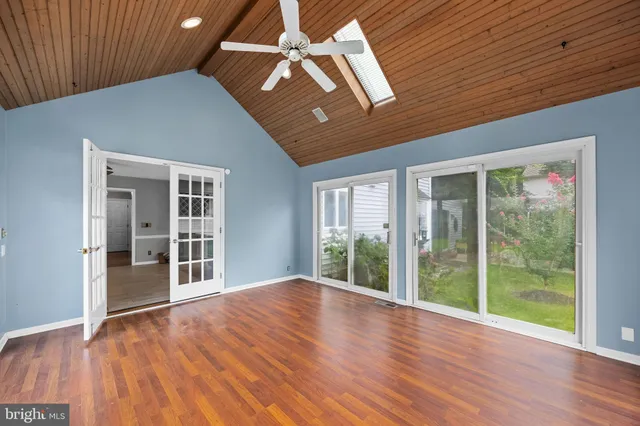 a bathroom with a double vanity sink a toilet and a shower