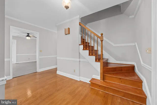 a bathroom with a sink a toilet a large mirror and shower