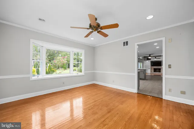 a view of an entryway with wooden floor and staircase