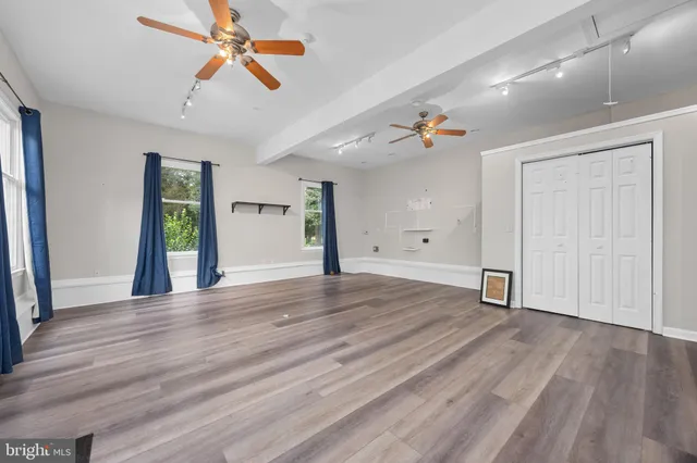 a view of a kitchen with a refrigerator a stove top oven a refrigerator and a window