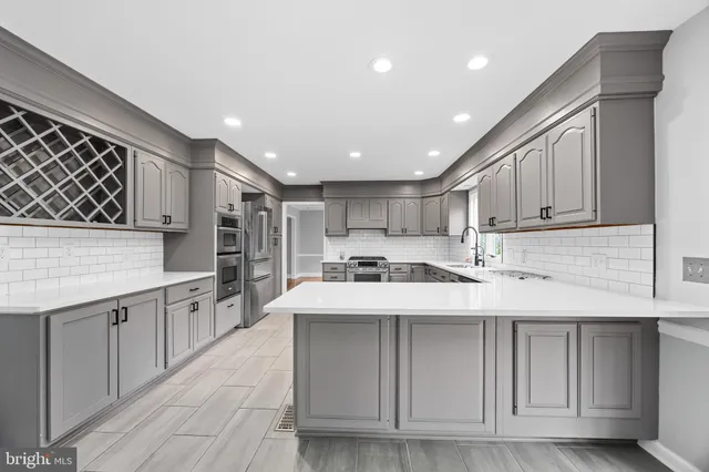 a view of a livingroom with wooden floor a fireplace and window