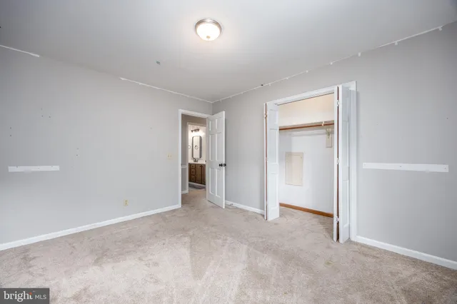 a view of a swimming pool with lounge chairs