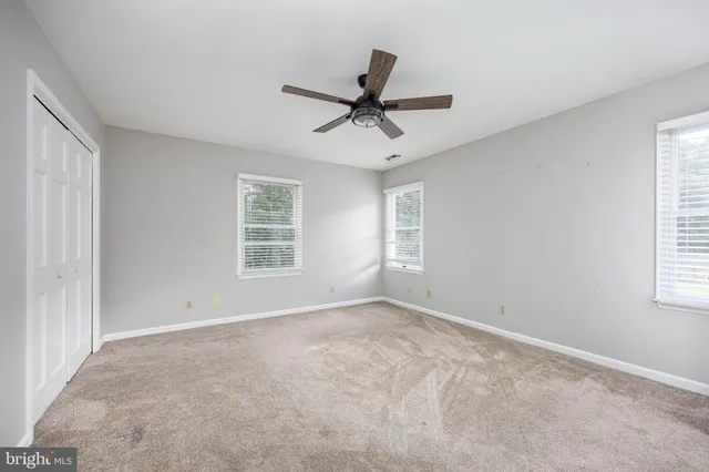 a view of a swimming pool with a patio and mountain view