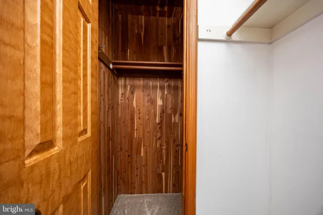 a view of yard with swimming pool and green space