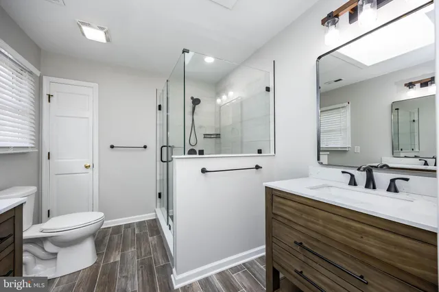 a view of a street with houses on both side of the street