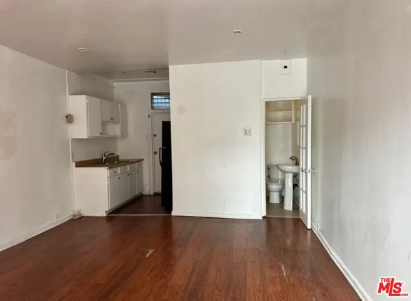 a view of kitchen with wooden floor