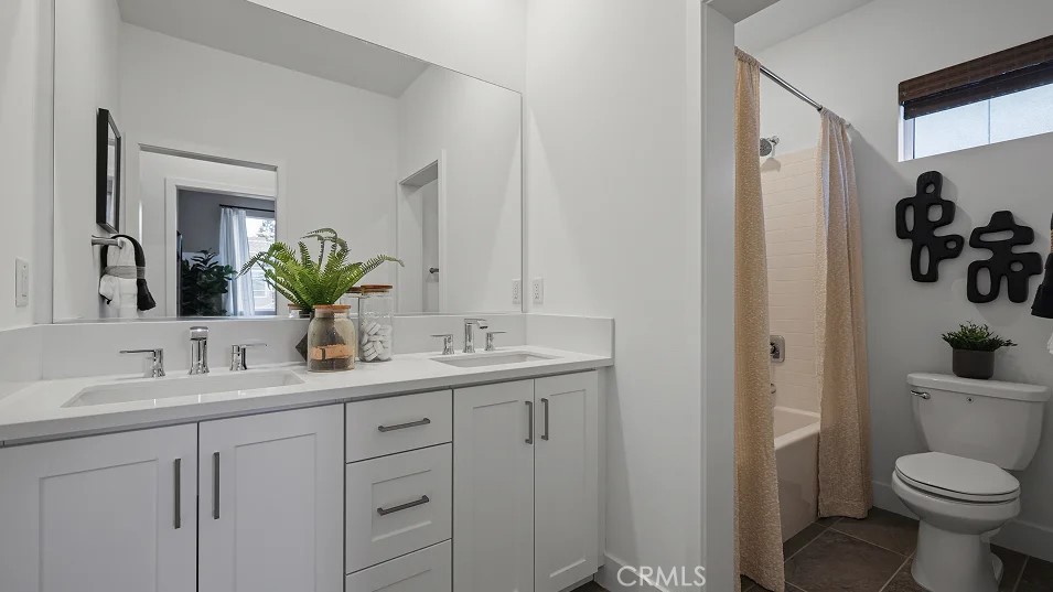 1025 Citron Road Fullerton, CA 92833 - Photo 16 of 25 a bathroom with a toilet sink and mirror