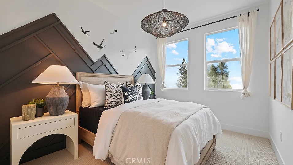 1025 Citron Road Fullerton, CA 92833 - Photo 17 of 25 a spacious bedroom with a large bed and a chandelier