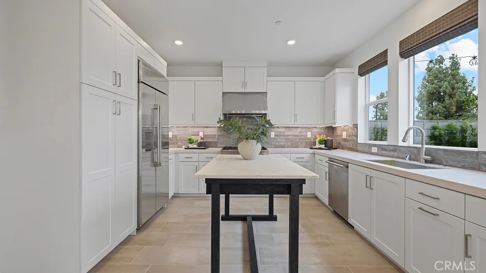 1025 Citron Road Fullerton, CA 92833 - Photo 2 of 25 a kitchen with white cabinets and white appliances