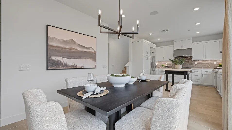1025 Citron Road Fullerton, CA 92833 - Photo 3 of 25 a view of a dining room with furniture a kitchen and chandelier