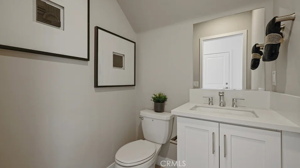 1025 Citron Road Fullerton, CA 92833 - Photo 9 of 25 a bathroom with a toilet sink and mirror