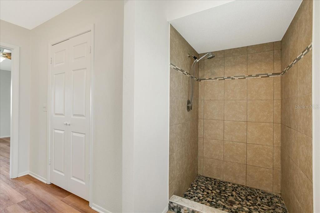 1312 Jamaica Road Venice, FL 34293 - Photo 26 of 35 Primary bathroom and primary closet