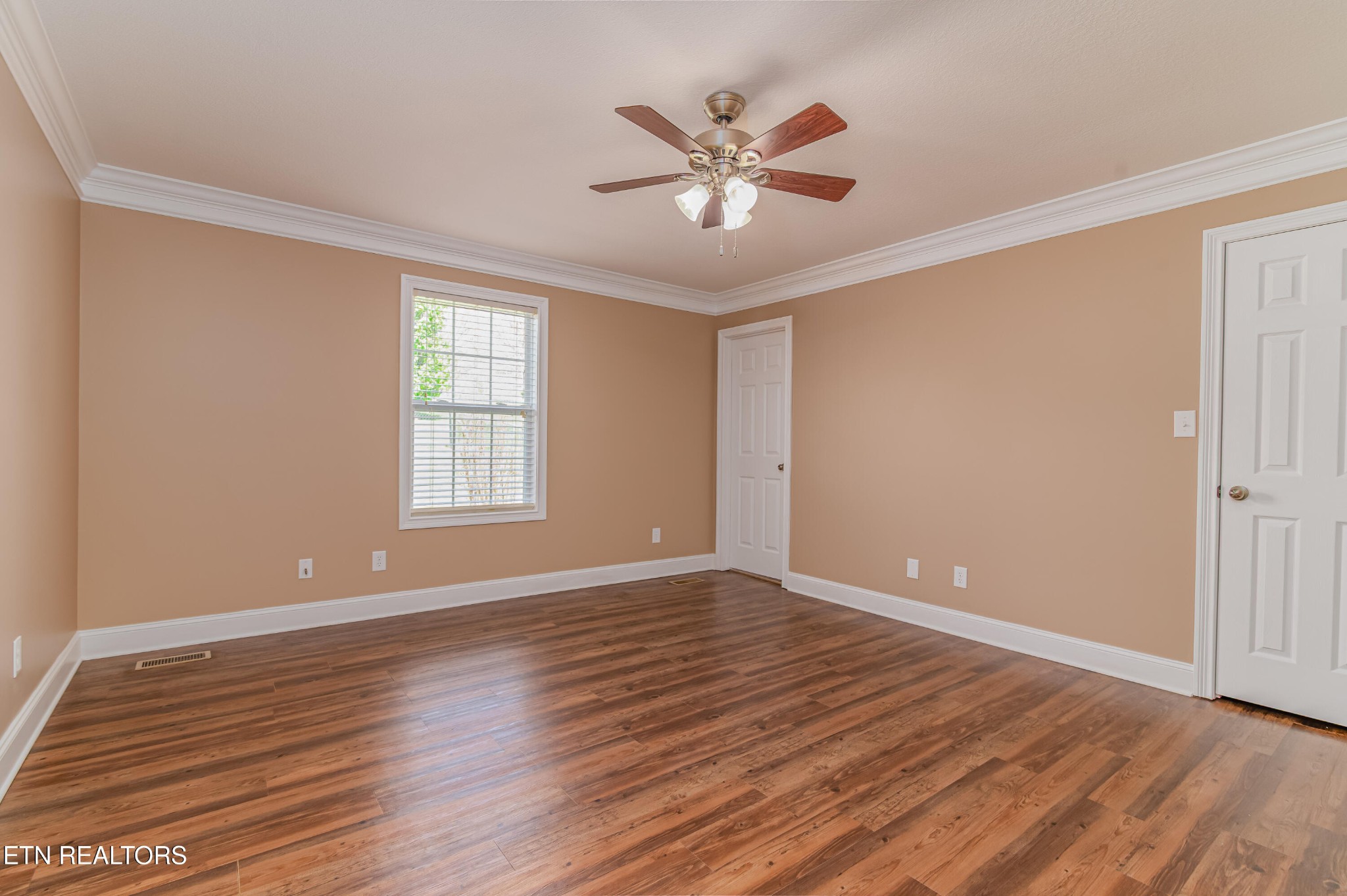 8007 Tazewell Pike Corryton, TN 37721 - Photo 13 of 43 a view of an empty room with wooden floor and a window