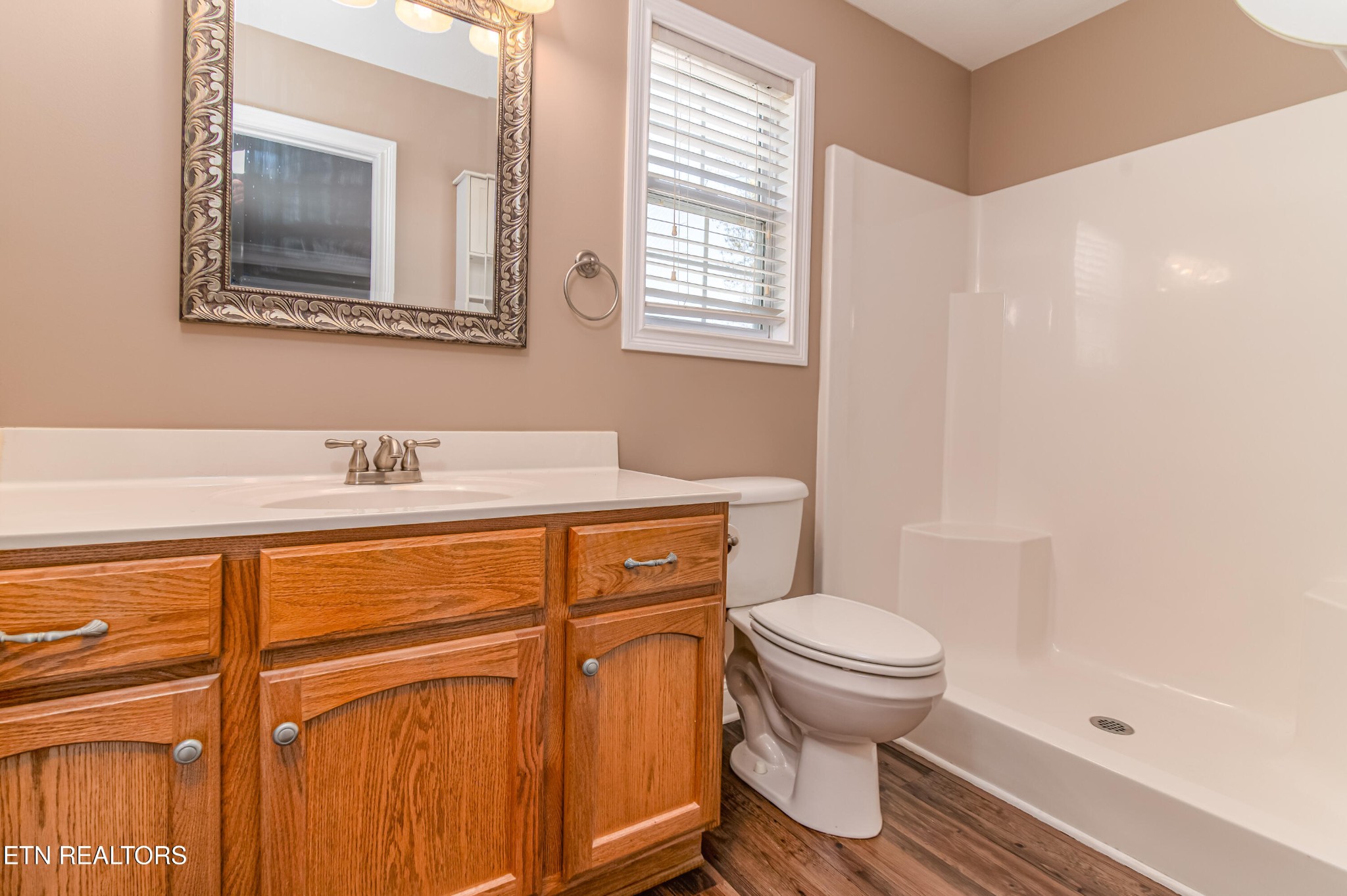 8007 Tazewell Pike Corryton, TN 37721 - Photo 15 of 43 a bathroom with a sink a toilet and a mirror