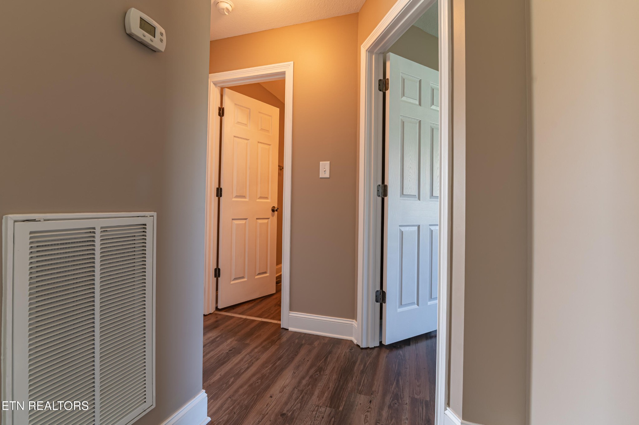 8007 Tazewell Pike Corryton, TN 37721 - Photo 17 of 43 a view of a hallway with wooden floor