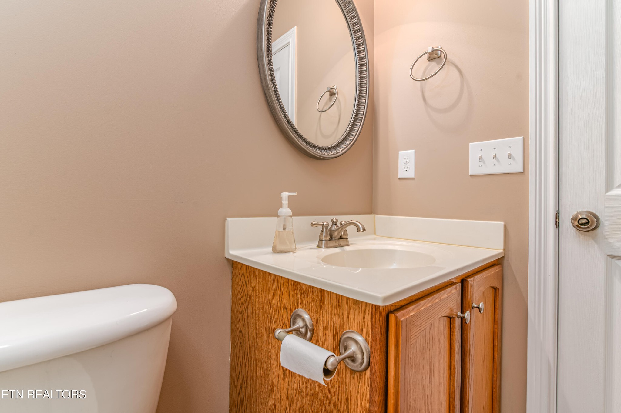 8007 Tazewell Pike Corryton, TN 37721 - Photo 24 of 43 a bathroom with a sink and a mirror