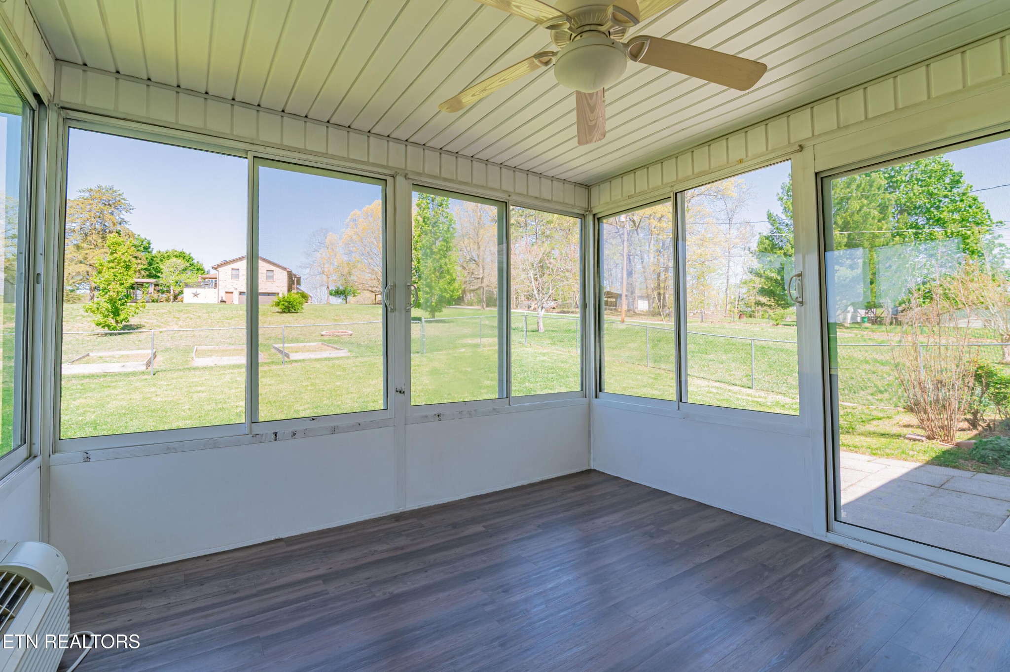 8007 Tazewell Pike Corryton, TN 37721 - Photo 26 of 43 a view of an empty room with wooden floor and a window
