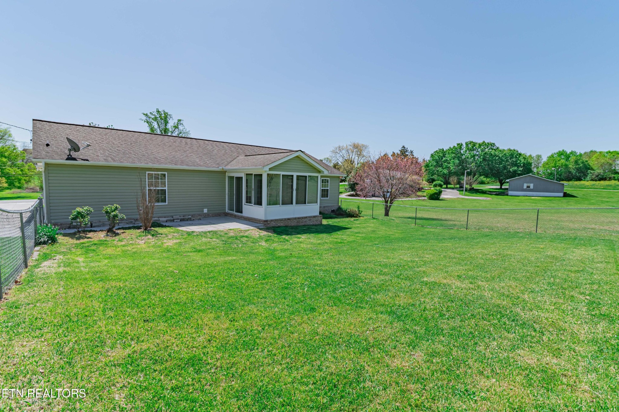 8007 Tazewell Pike Corryton, TN 37721 - Photo 30 of 43 a front view of a house with a yard table and chairs