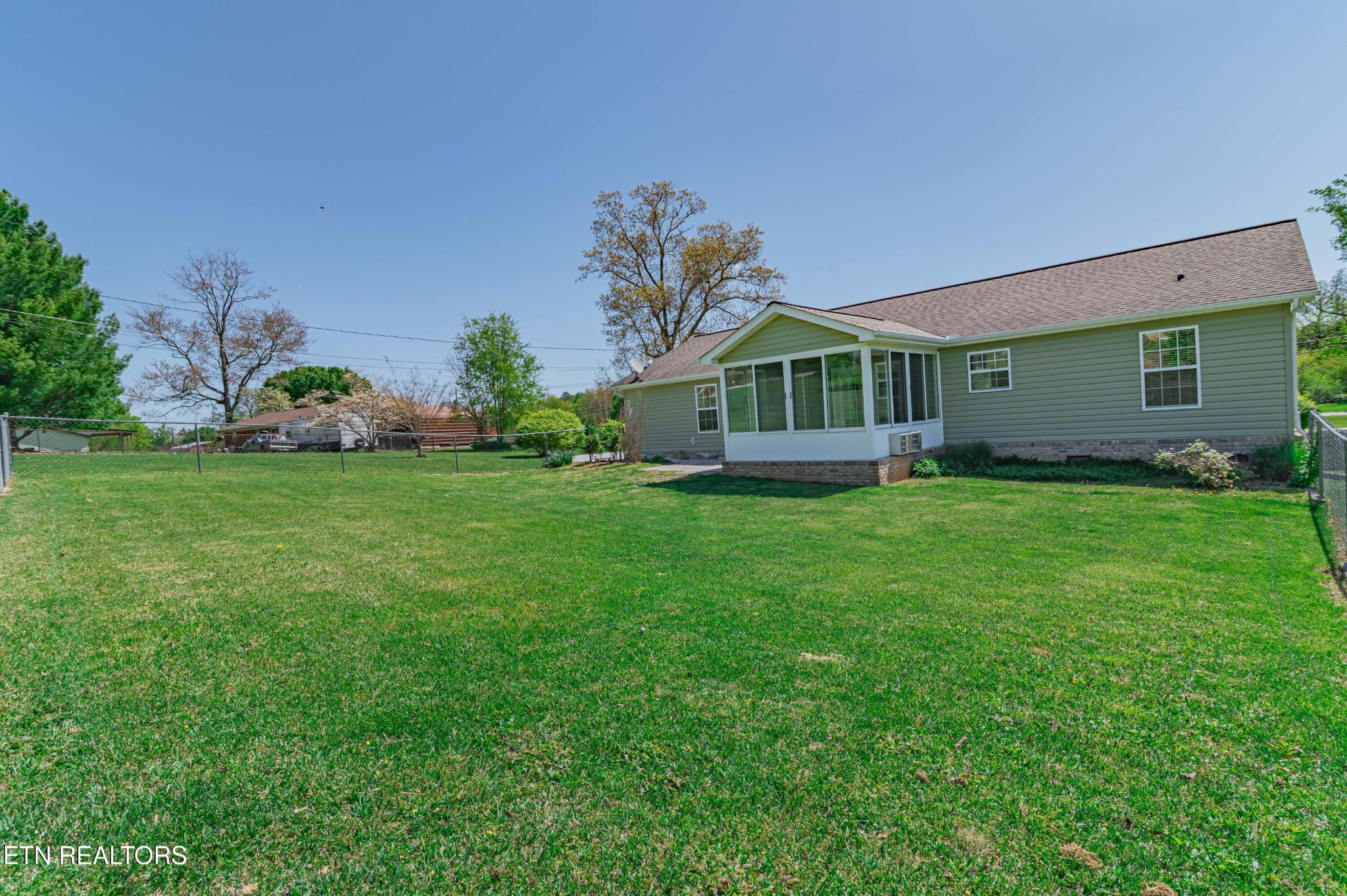 8007 Tazewell Pike Corryton, TN 37721 - Photo 31 of 43 a front view of a house with garden