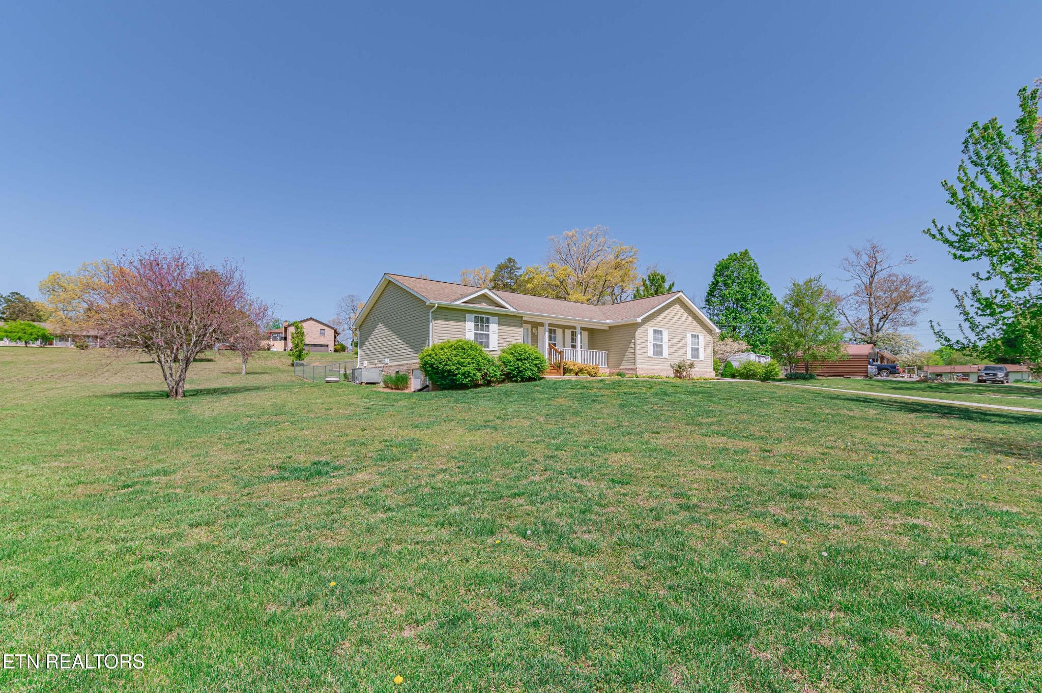 8007 Tazewell Pike Corryton, TN 37721 - Photo 37 of 43 a front view of a house with garden