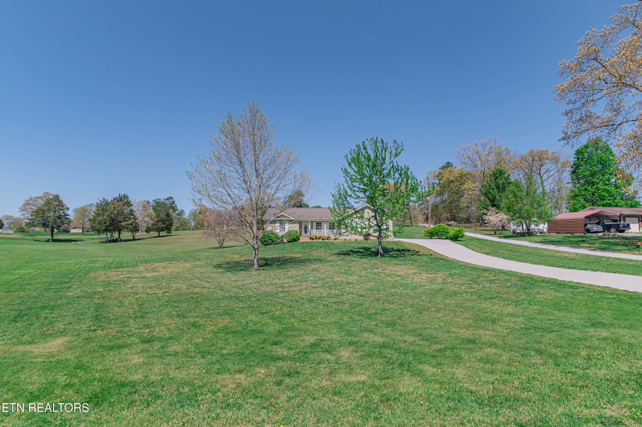 8007 Tazewell Pike Corryton, TN 37721 - Photo 39 of 43 a garden with trees in the background