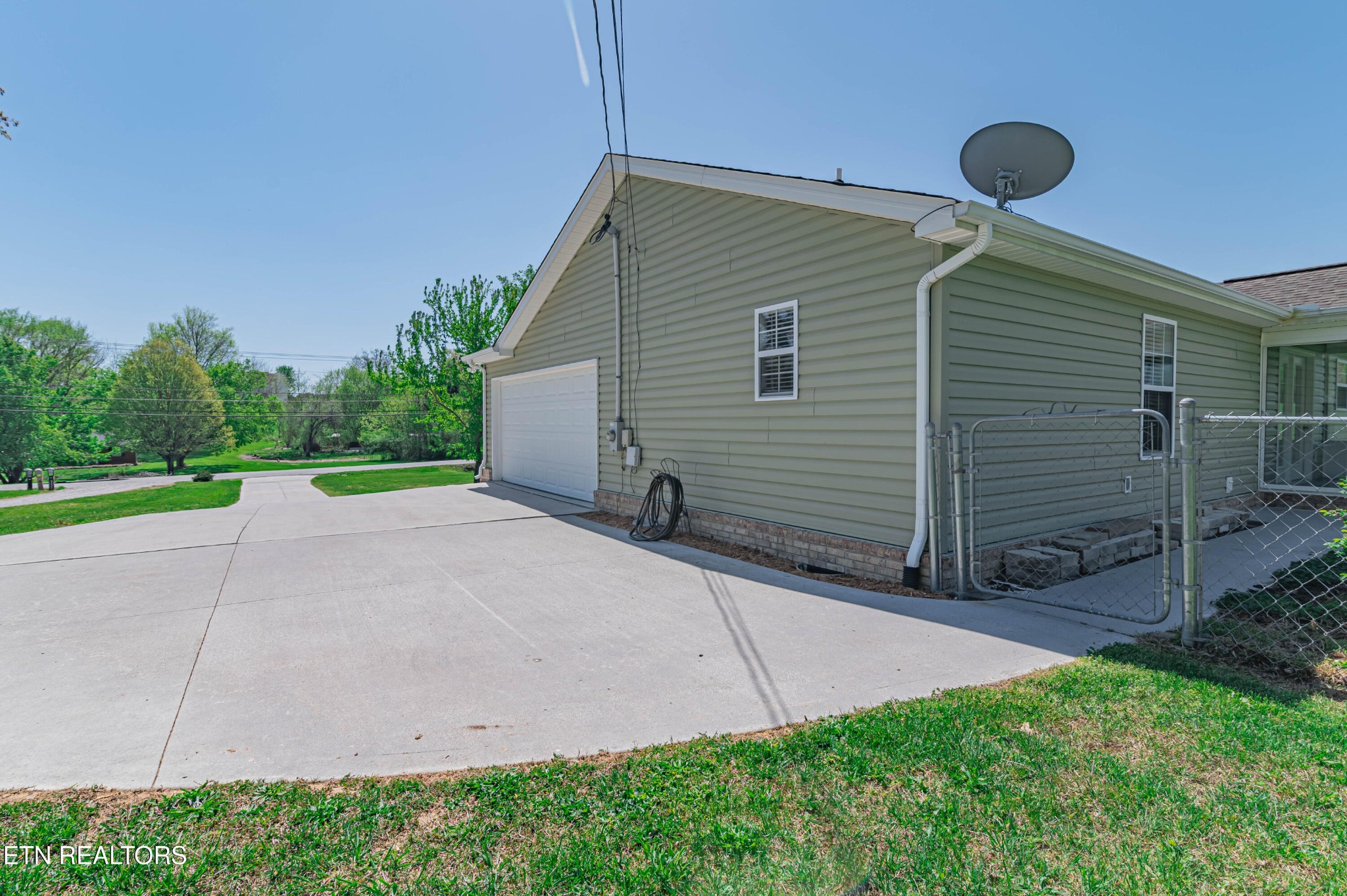 8007 Tazewell Pike Corryton, TN 37721 - Photo 41 of 43 a backyard of a house with table and chairs