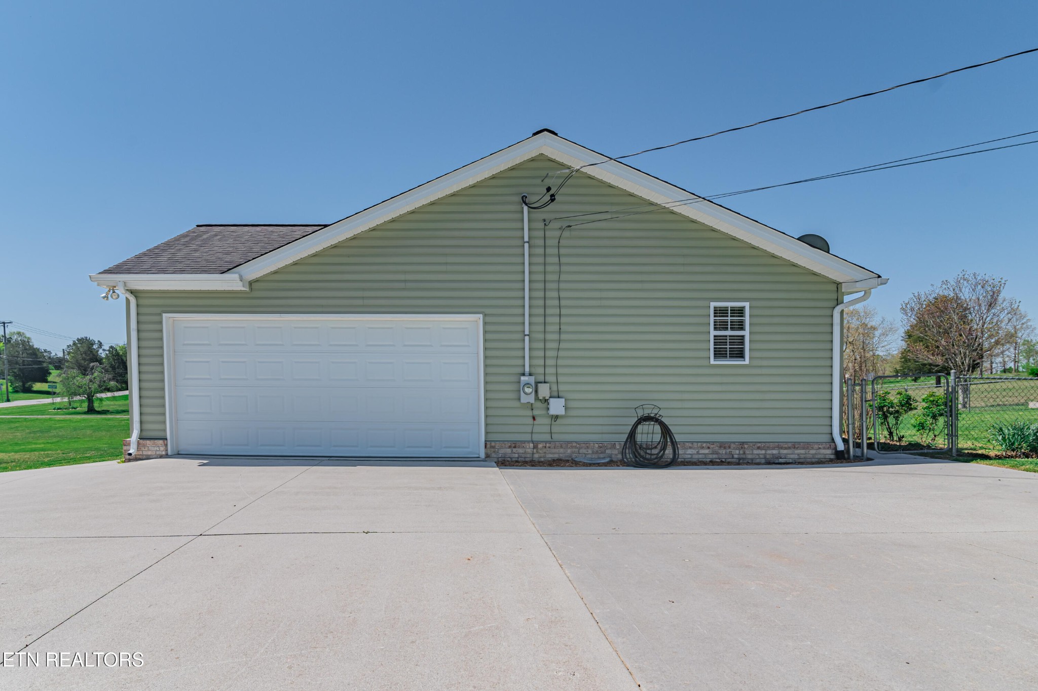 8007 Tazewell Pike Corryton, TN 37721 - Photo 43 of 43 a view of backyard of house and garage