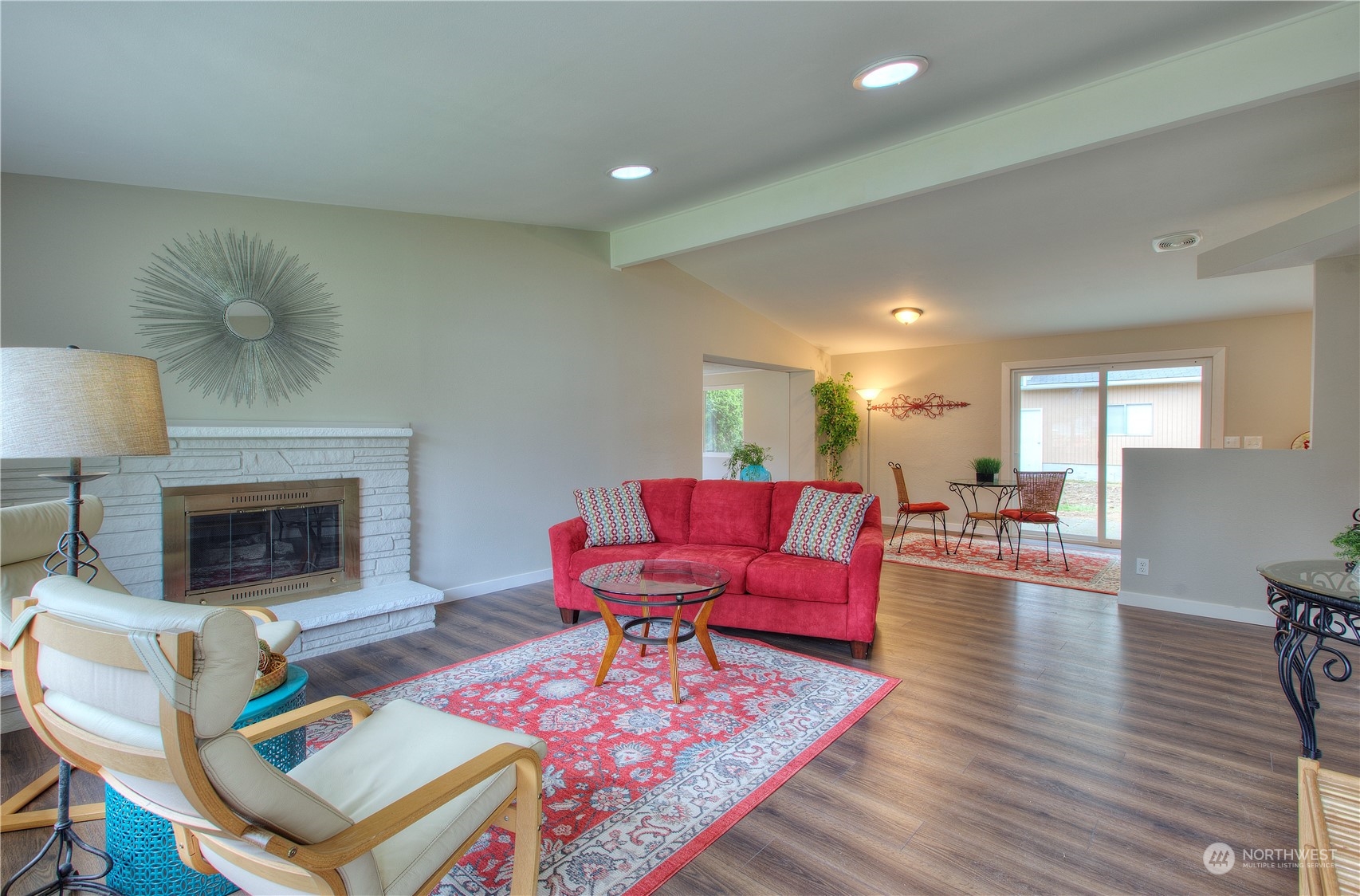 15436 Southeast 144th Place Renton, WA 98059 - Photo 3 of 18 a living room with furniture and a fireplace