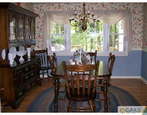 16 Huntington Road Edison, NJ 08820 - Photo 3 of 8 a view of a dining room with furniture window and outside view