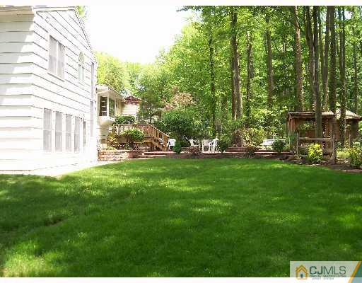 16 Huntington Road Edison, NJ 08820 - Photo 8 of 8 a view of yard with grass and trees
