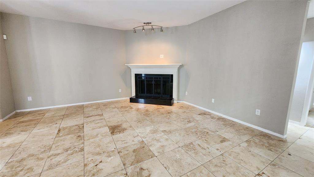 an empty room with a fireplace