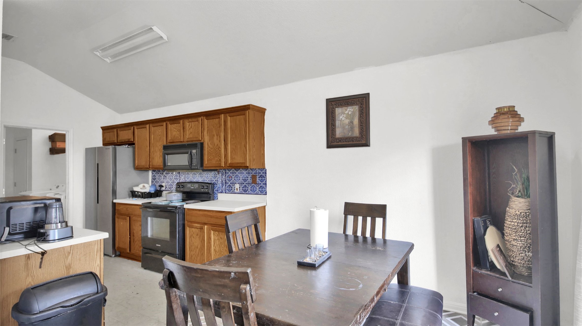 9609 Magna Carta Loop Austin, TX 78754 - Photo 11 of 30 a view of a dining room with furniture window and wooden floor