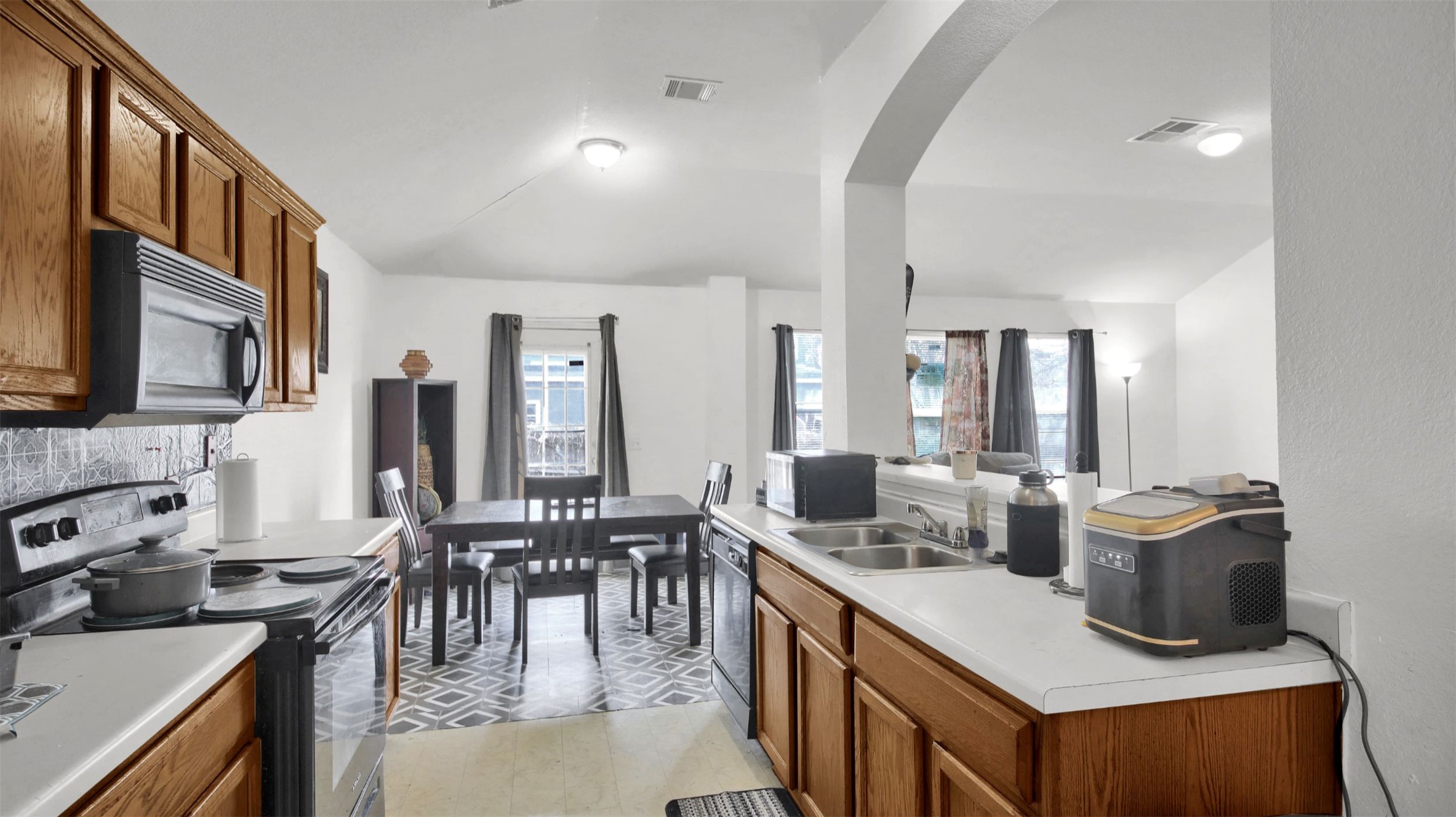 9609 Magna Carta Loop Austin, TX 78754 - Photo 15 of 30 a large kitchen with lots of counter space and windows