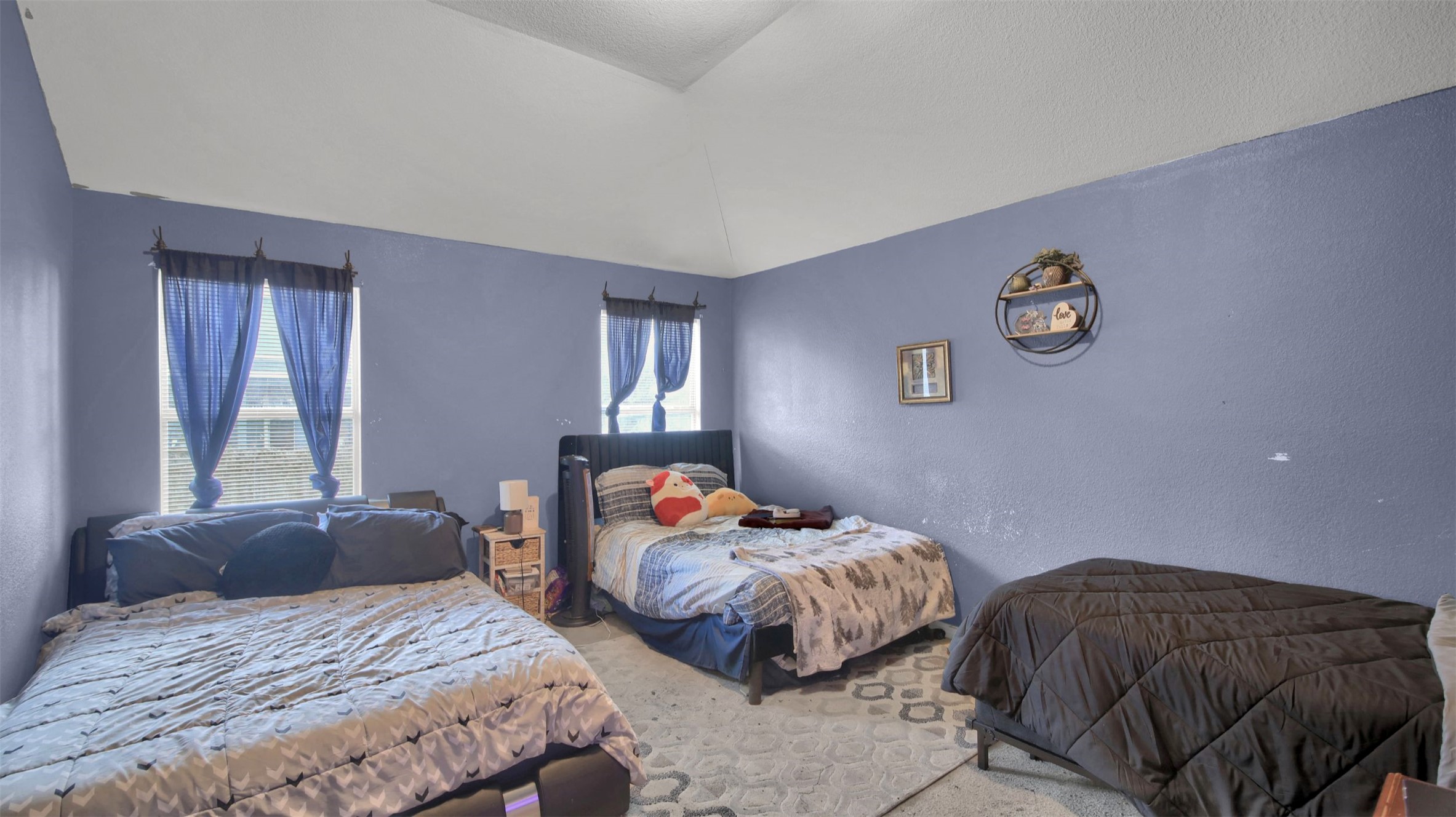 9609 Magna Carta Loop Austin, TX 78754 - Photo 17 of 30 a bedroom with two beds and a window