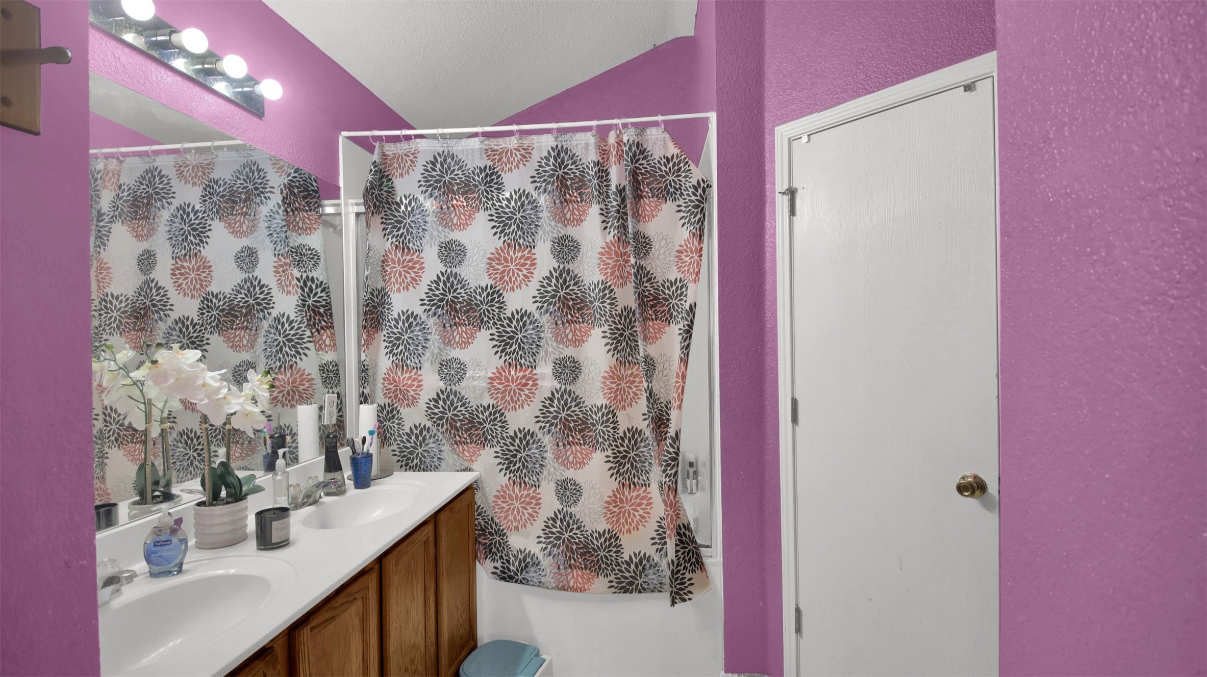 9609 Magna Carta Loop Austin, TX 78754 - Photo 20 of 30 a bathroom with a sink mirror and shower
