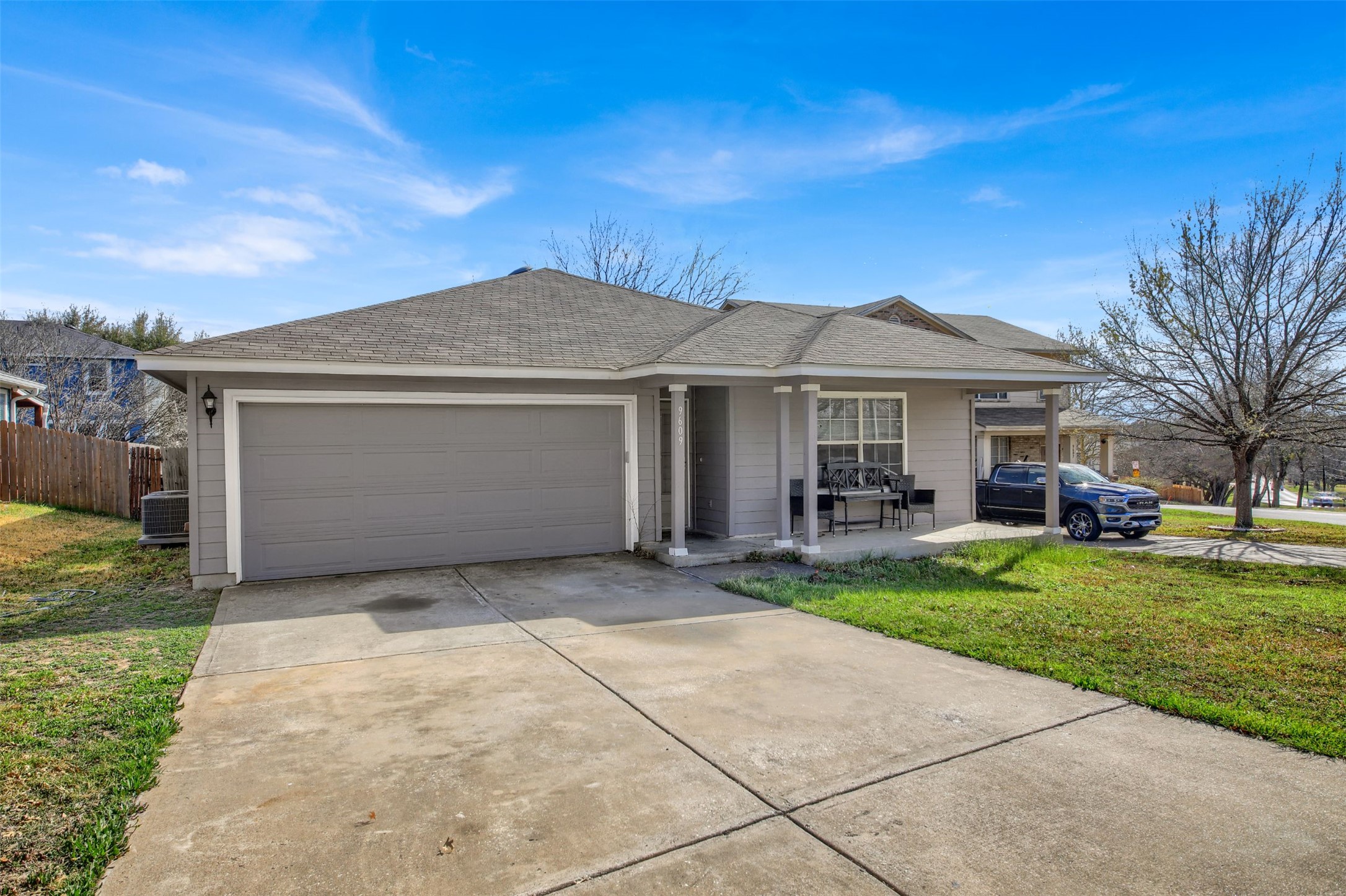 9609 Magna Carta Loop Austin, TX 78754 - Photo 2 of 30 a front view of a house with a garden and yard