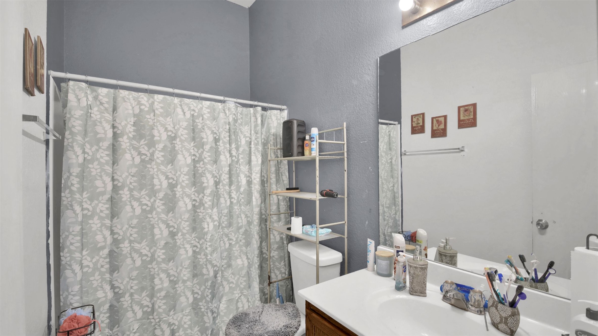 9609 Magna Carta Loop Austin, TX 78754 - Photo 22 of 30 a bathroom with a sink and a mirror