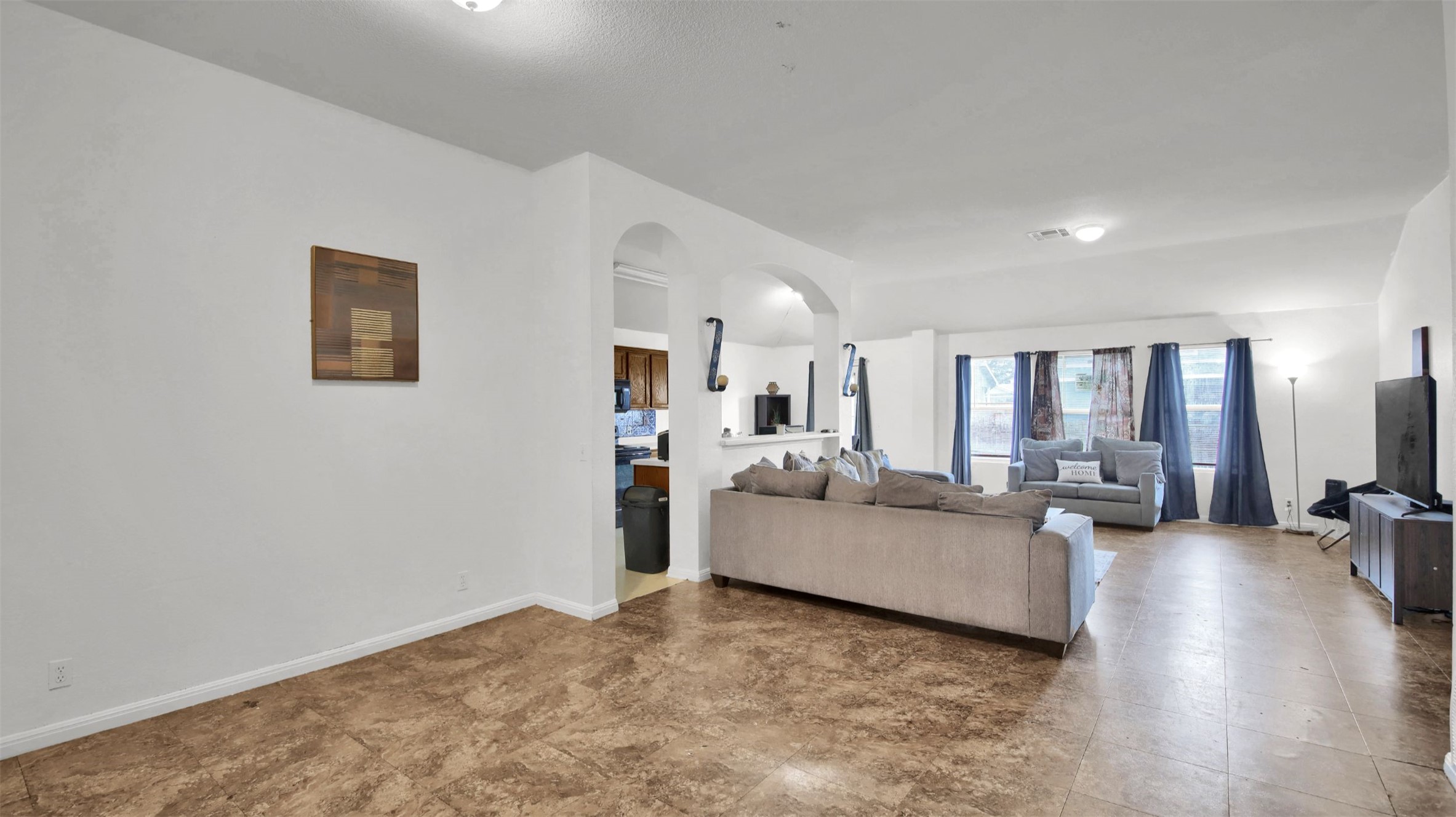9609 Magna Carta Loop Austin, TX 78754 - Photo 5 of 30 a living room with couches and a view of kitchen
