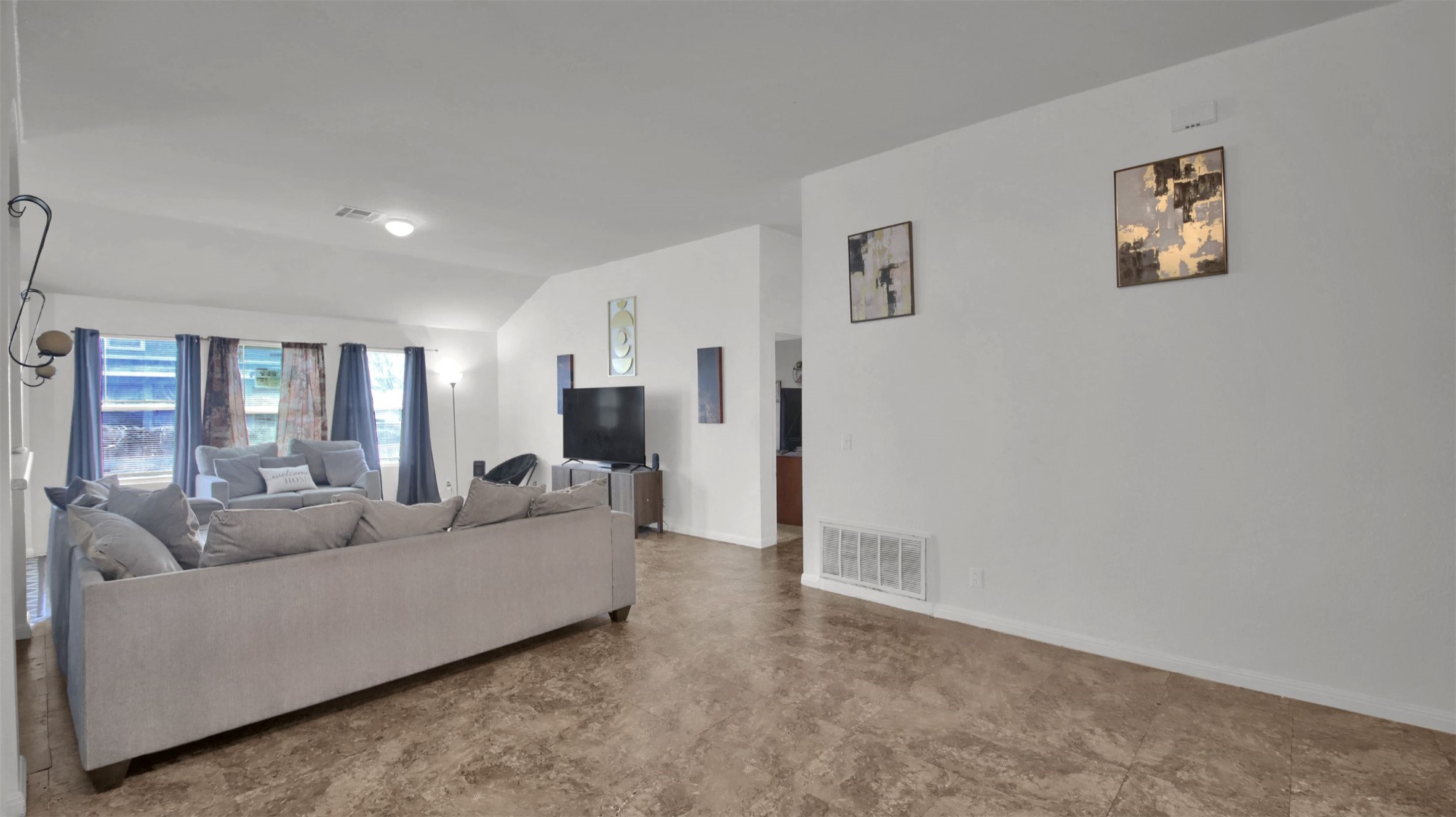 9609 Magna Carta Loop Austin, TX 78754 - Photo 6 of 30 a living room with furniture and a floor to ceiling window