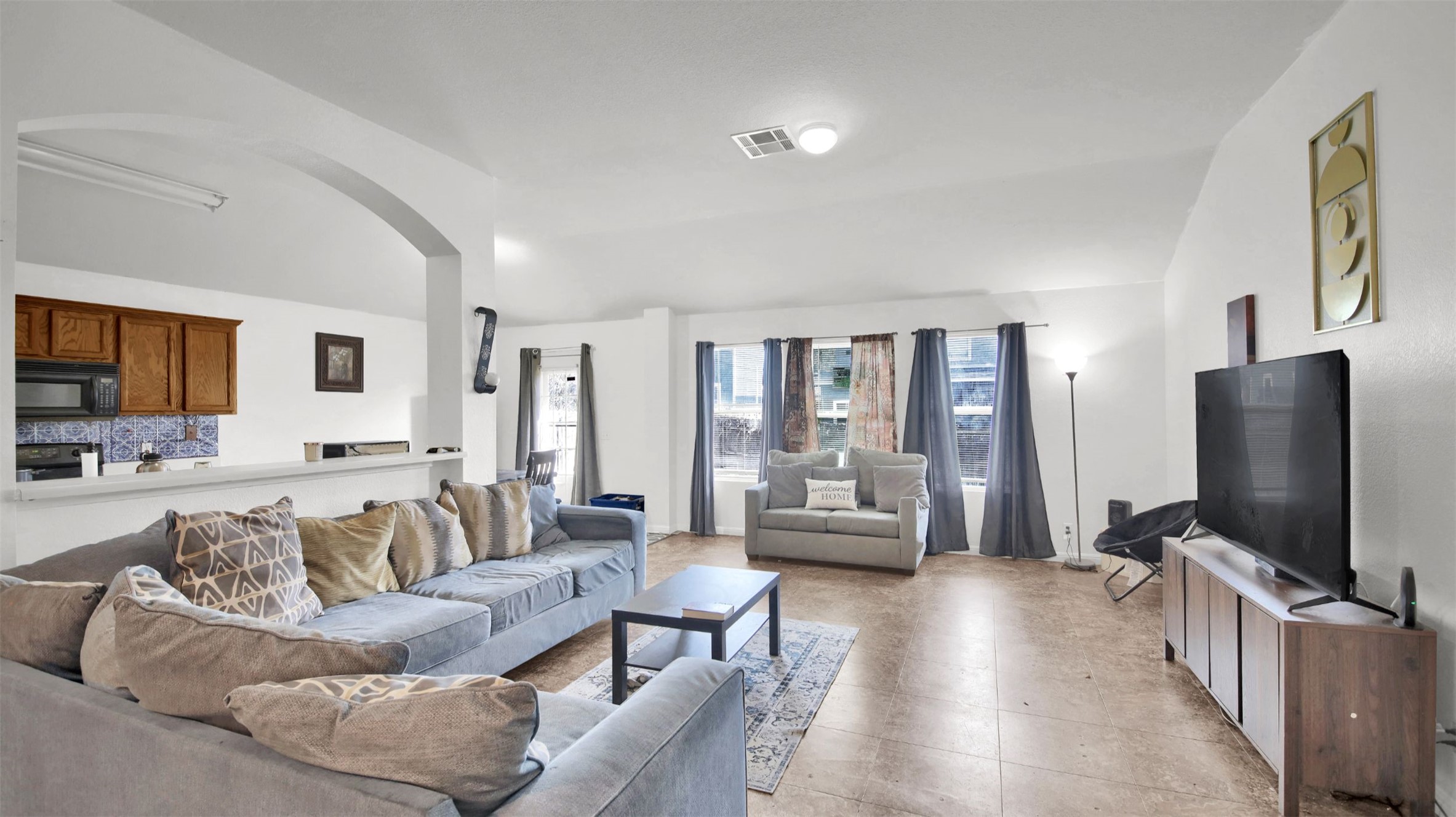 9609 Magna Carta Loop Austin, TX 78754 - Photo 7 of 30 a living room with furniture wooden floor and a flat screen tv